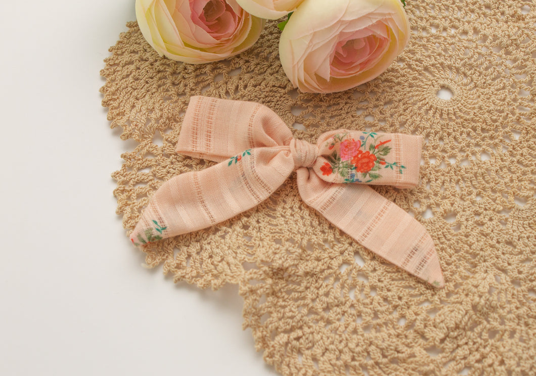 Coral blossom bow